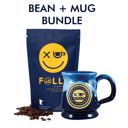 Folly Coffee 12oz whole bean bag with handmade navy and powder blue Deneen stoneware mug bundle.